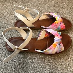 Pink and white sandals.